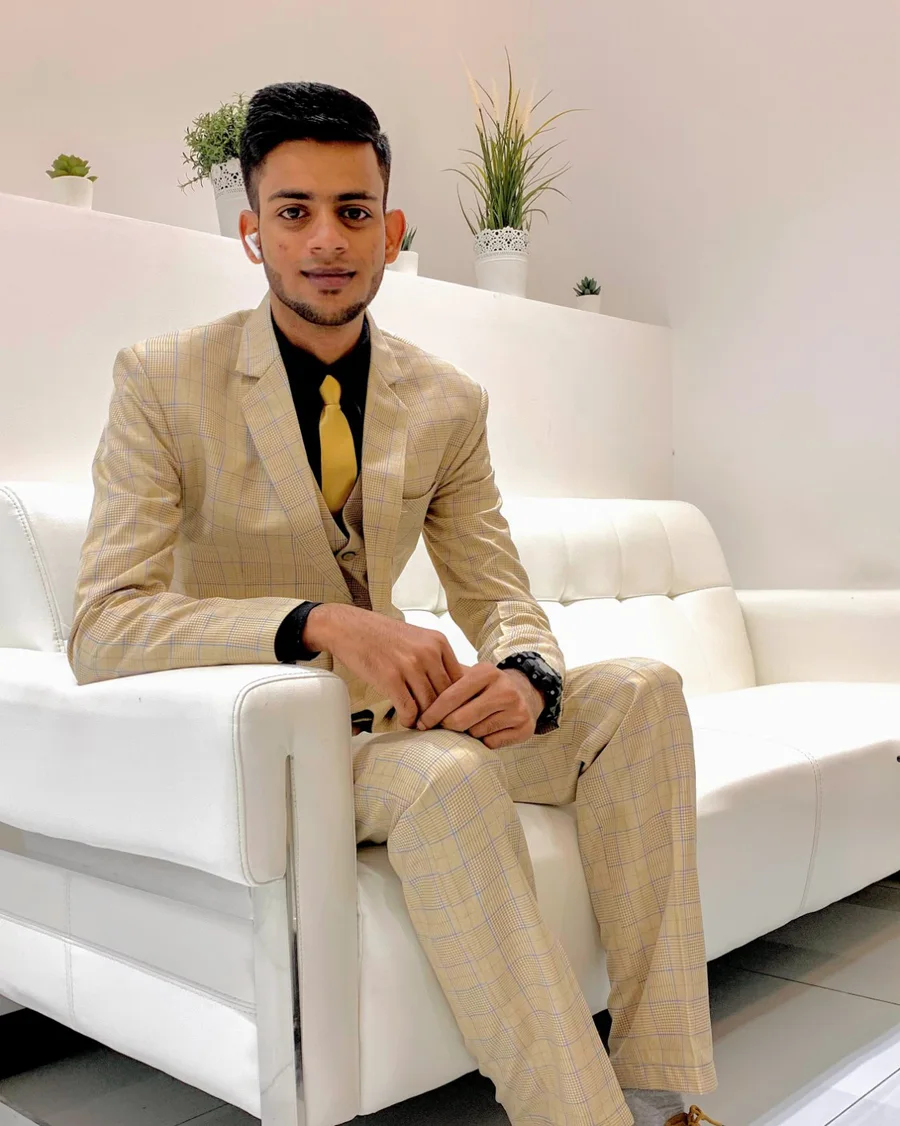 Syed Taqiuddin in a beige check suit